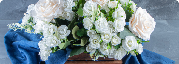 box-white-flowers-with-towel-white-table@2x box-white-flowers-with-towel-white-table@2x